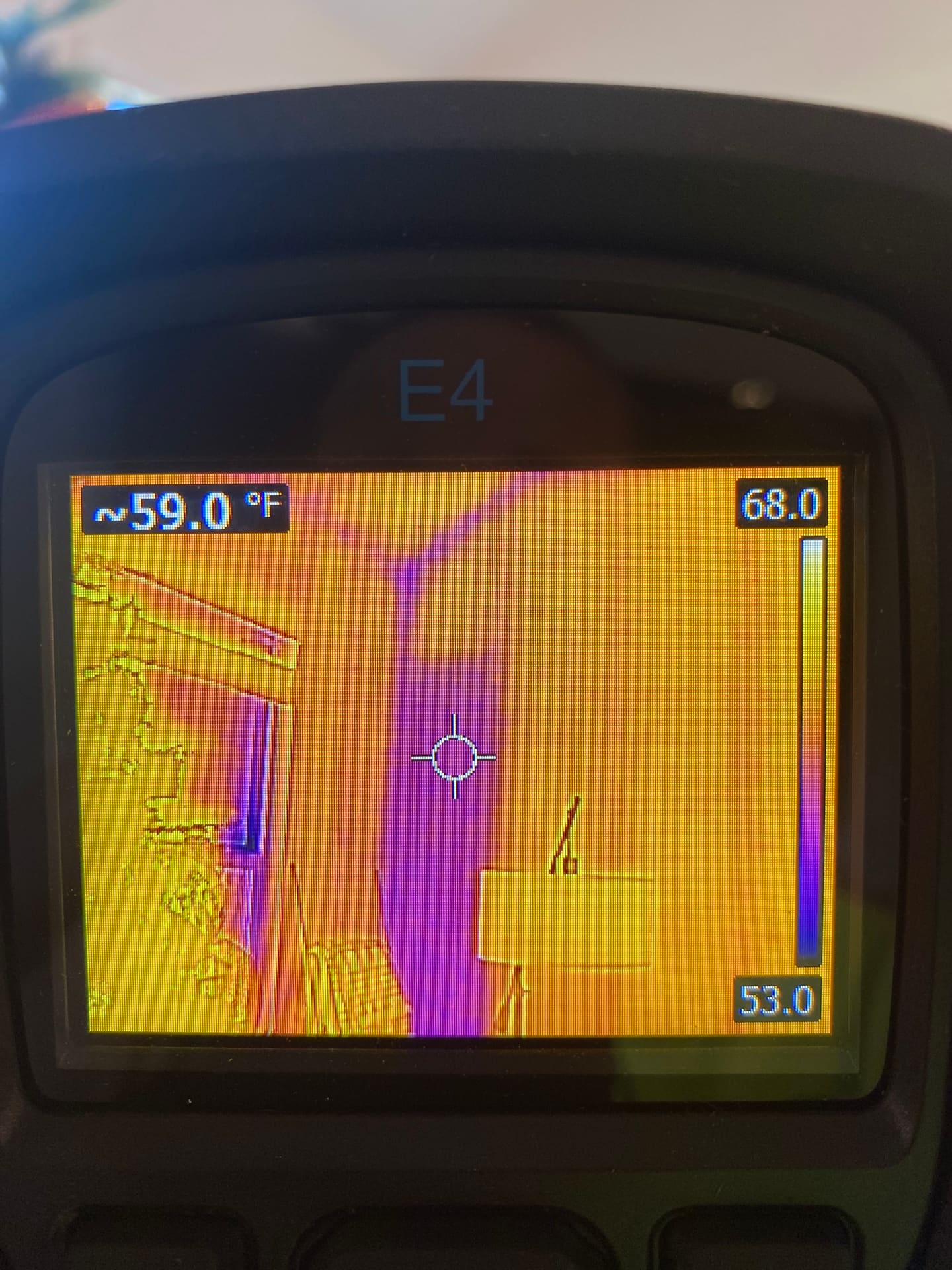 A thermal imaging scan checking a doorway for air leaks during a re-inspection.